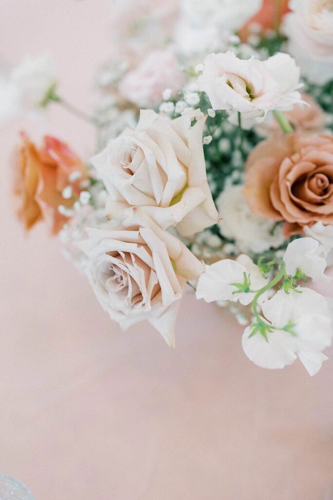 Elegant floral arrangement at The Pines, featuring soft tones and delicate roses for the wedding.