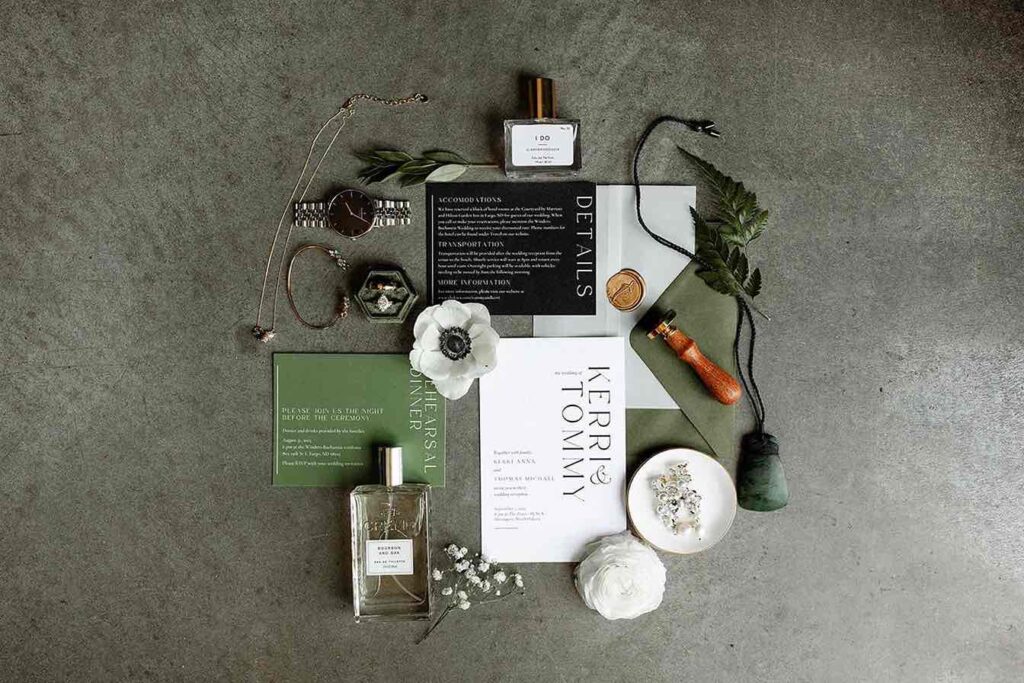 Flatlay showcasing wedding details, including invitations, rings, florals, and accessories for Bride and Groom's wedding