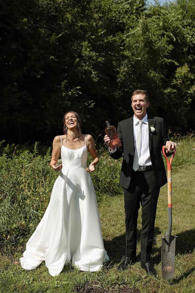 Couple laughing after their whiskey burial ceremony at The Pines